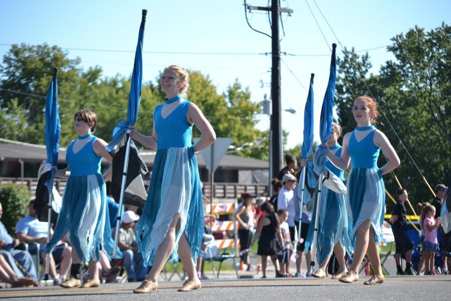 Jean McClelland ('17) is part of the RV Color Guard who marched with the band at the Harvest Festival.