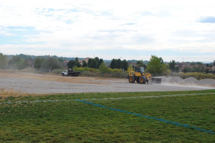 The new parking lot will be built right next to the soccer fields that are north of the school.
