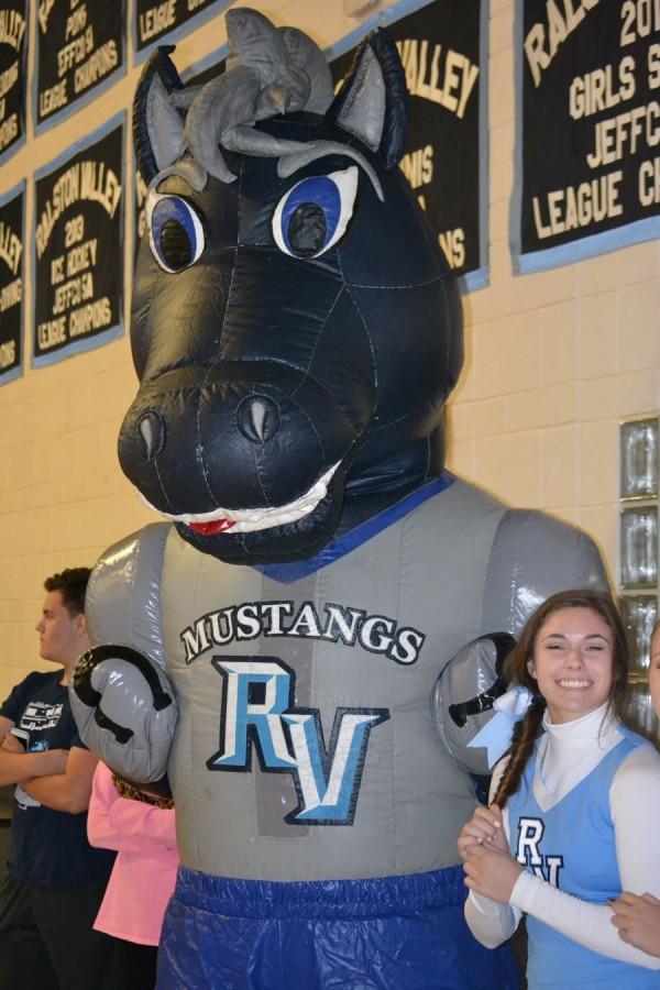 Maverick and Nicole Young (16) get prepared for the Homecoming Assembly.