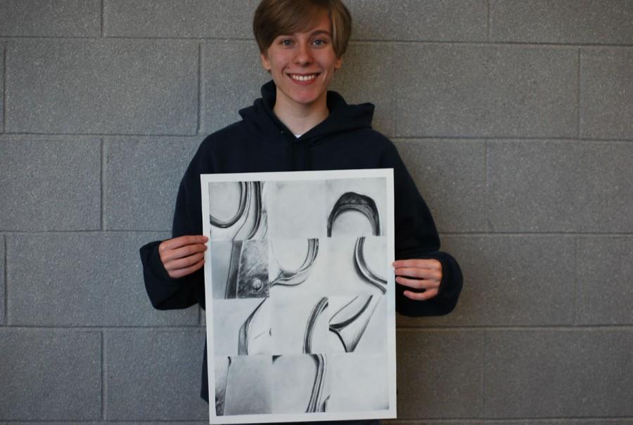 Jordan Callaway poses with one of her many art pieces